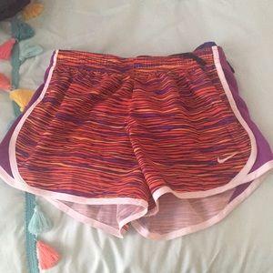 Kids Nike shorts. Purple red and orange